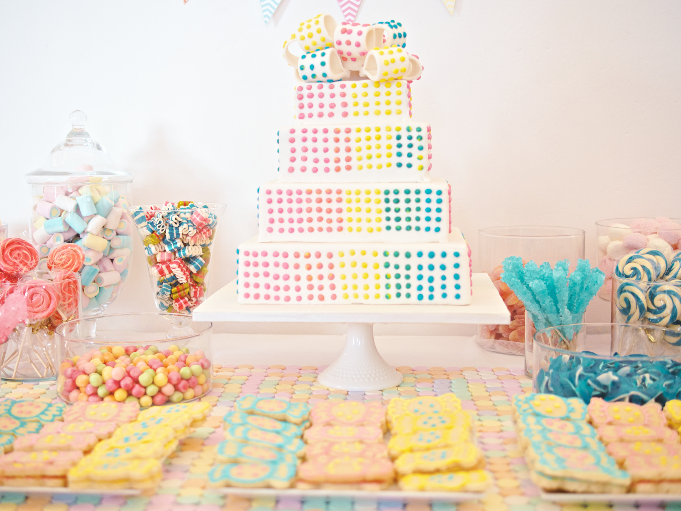 Baby party table setting with cake and candies